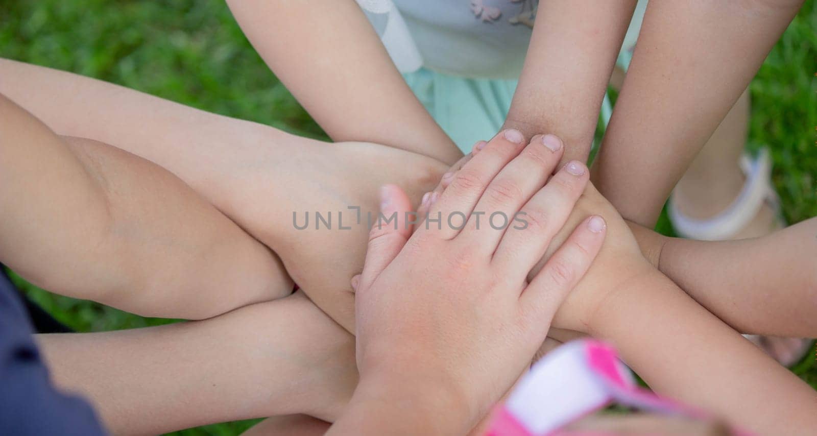 children, friends are playing in the garden, holding hands. selective focus