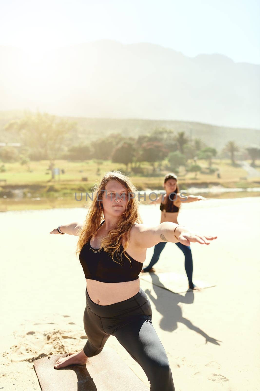 Yoga makes you feel comfortable with your body. a beautiful young woman practising yoga on the beach