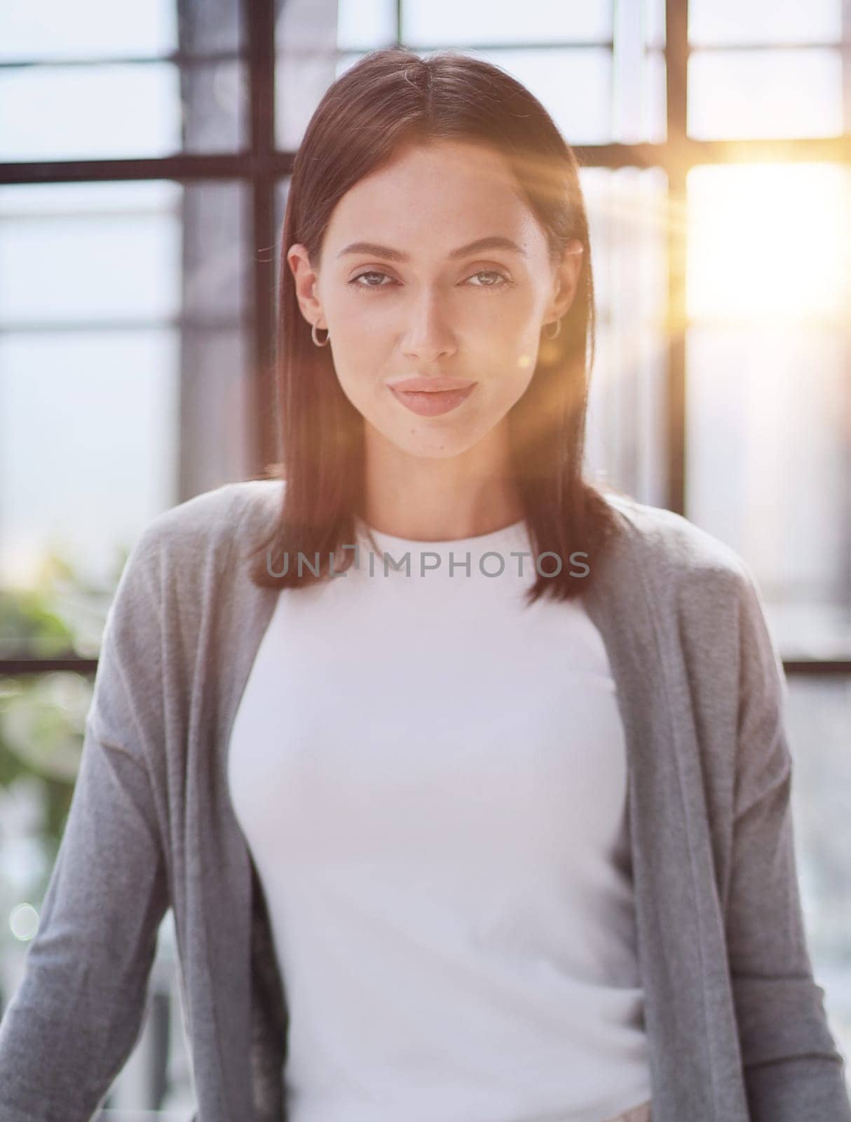 Portrait of a young business woman in an office by Prosto