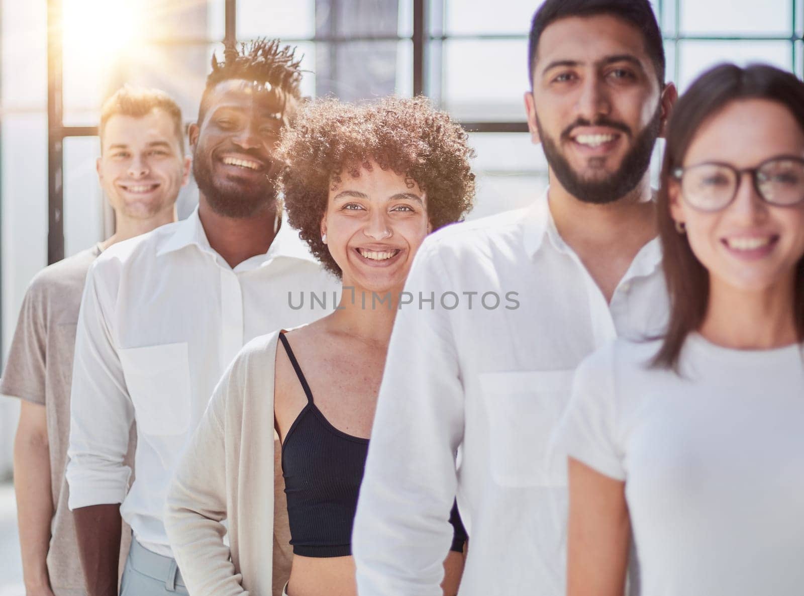 Face of beautiful woman on the background of business people