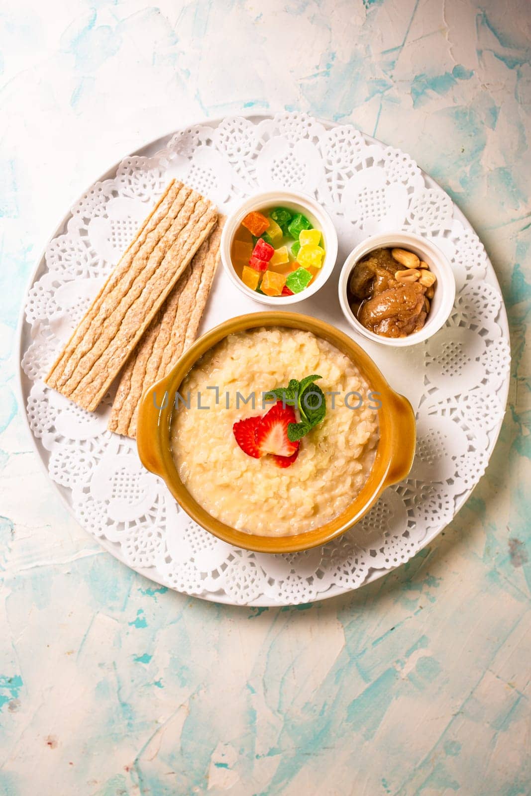 healthy breakfast. porridge with berries and loaves top view by Pukhovskiy