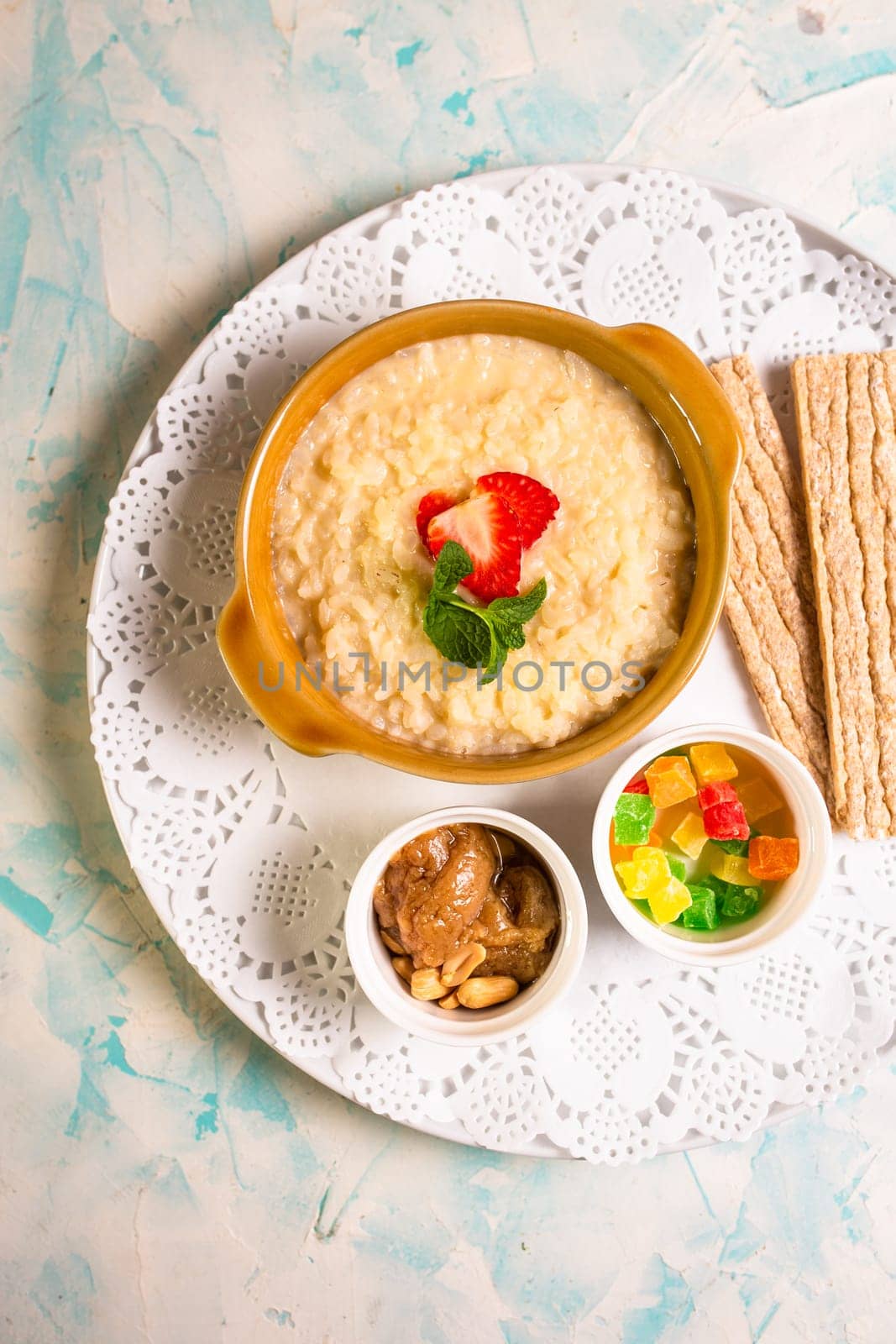 healthy breakfast. porridge with berries and loaves top view by Pukhovskiy