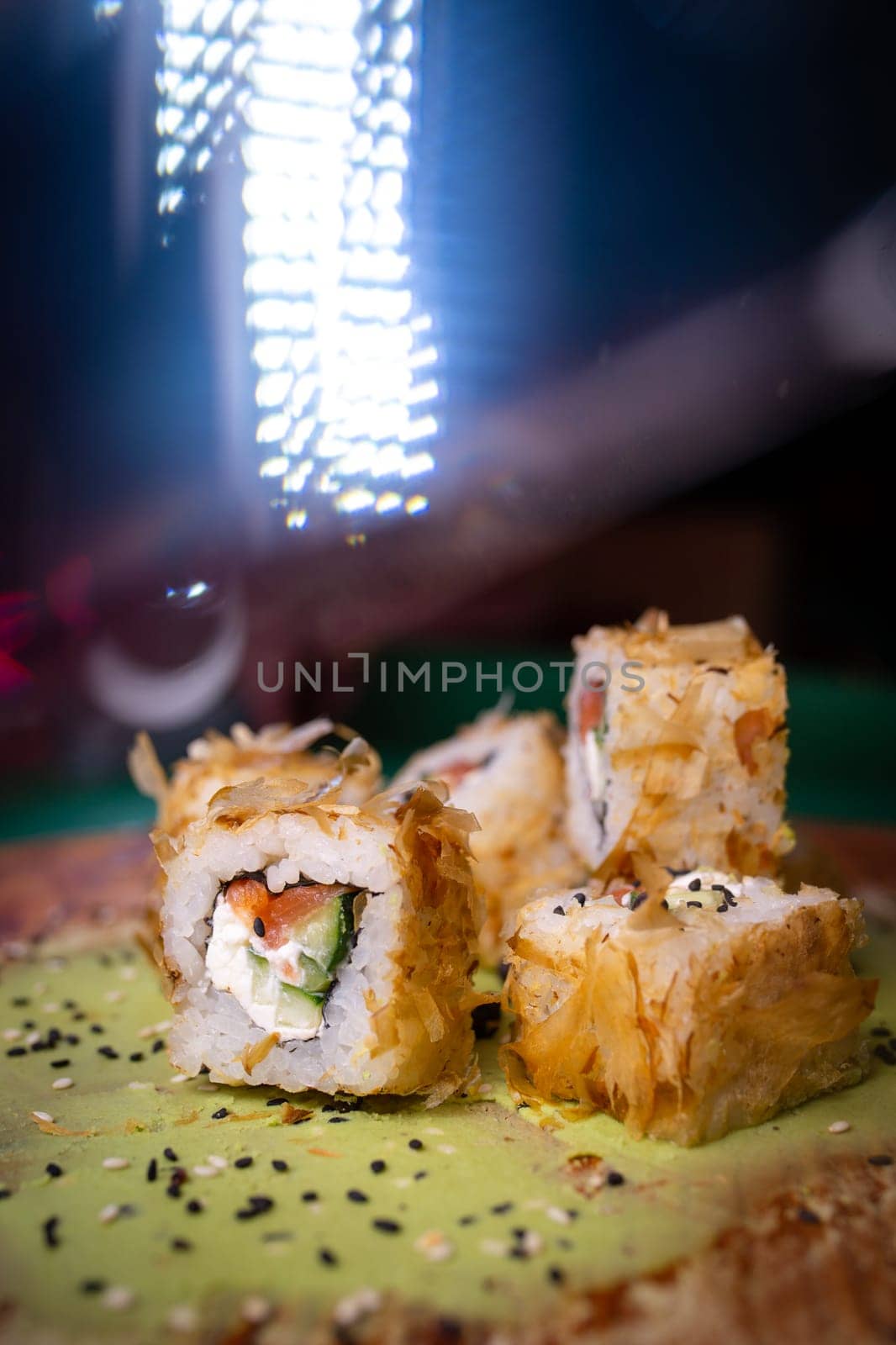 warm rolls on a wooden board with wasabi by Pukhovskiy