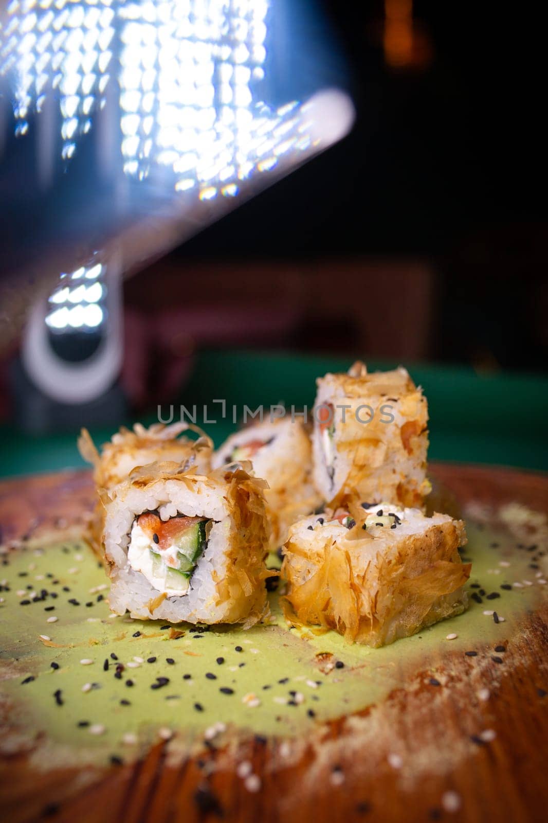 warm rolls on a wooden board with wasabi by Pukhovskiy