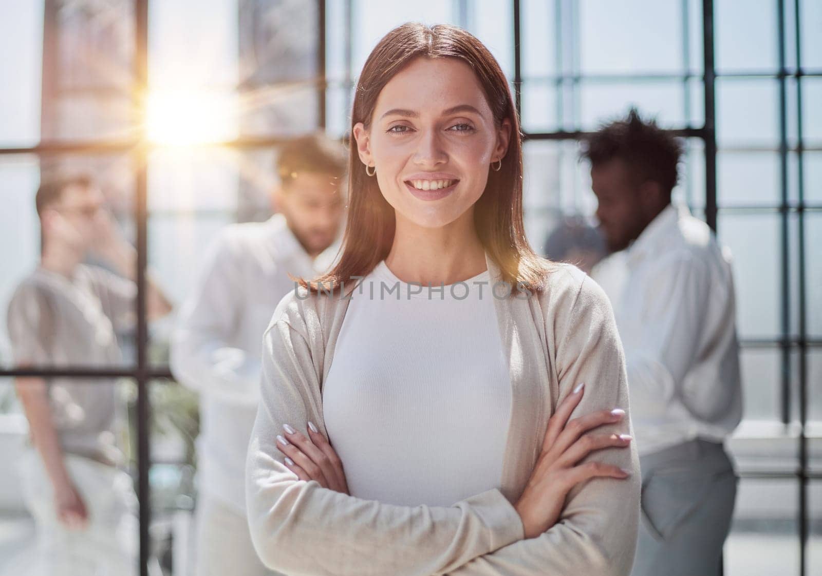 Face of beautiful woman on the background of business people