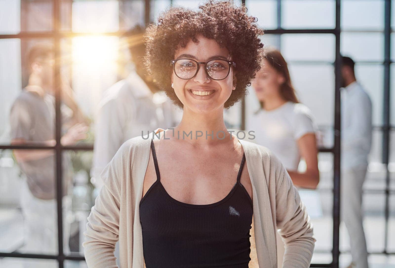Face of beautiful woman on the background of business people