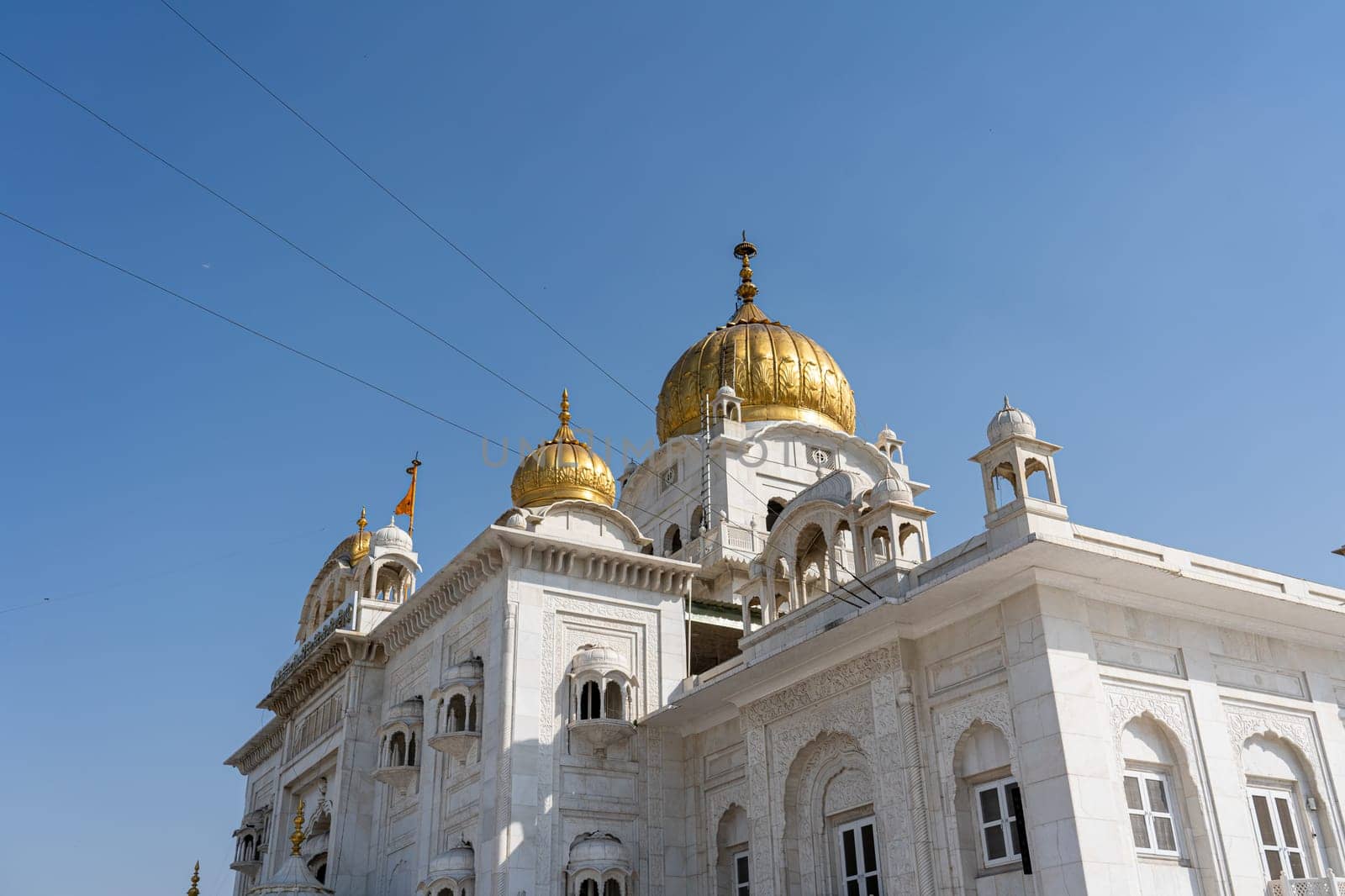New Delhi, India - April 11, 2023: Exterior view of Gurudwara Bangla Sahib, a famous Sikh house of worship.