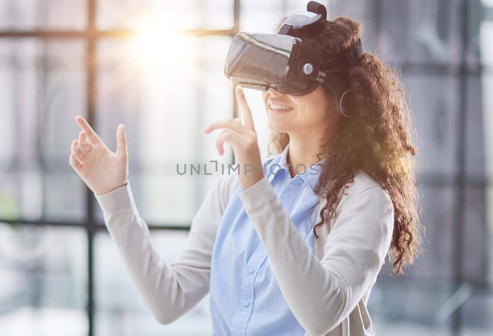 Girl trying to touch objects in virtual reality.