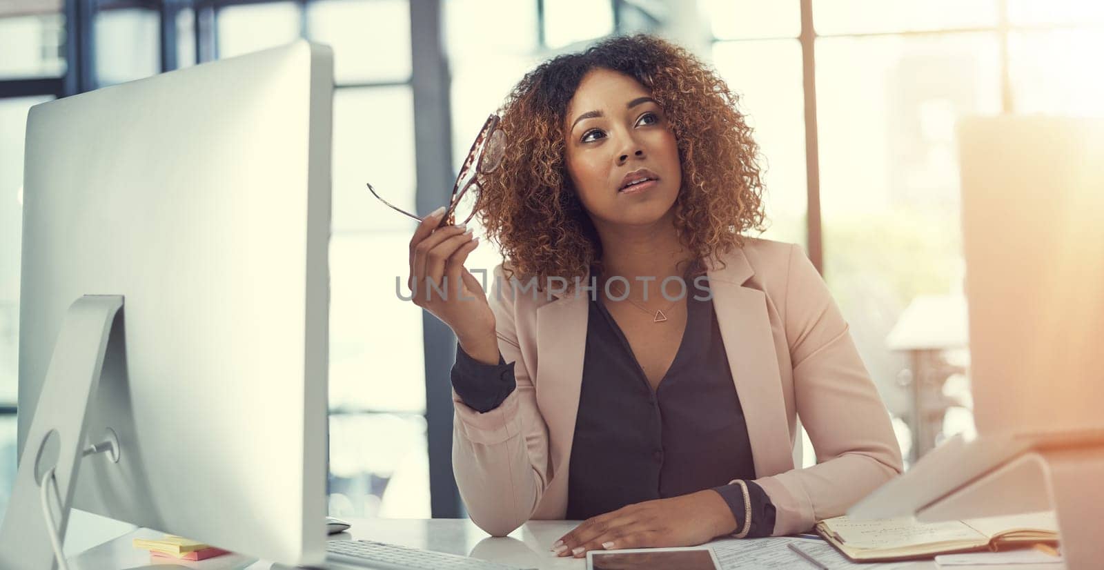 The right decision turns a plan into profit. a thoughtful young businesswoman working at her desk in a modern office