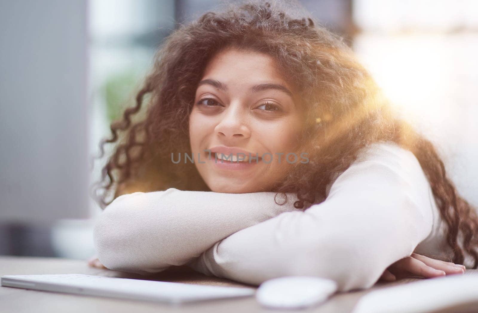 Portrait of a beautiful business woman sleeping on the table in the office