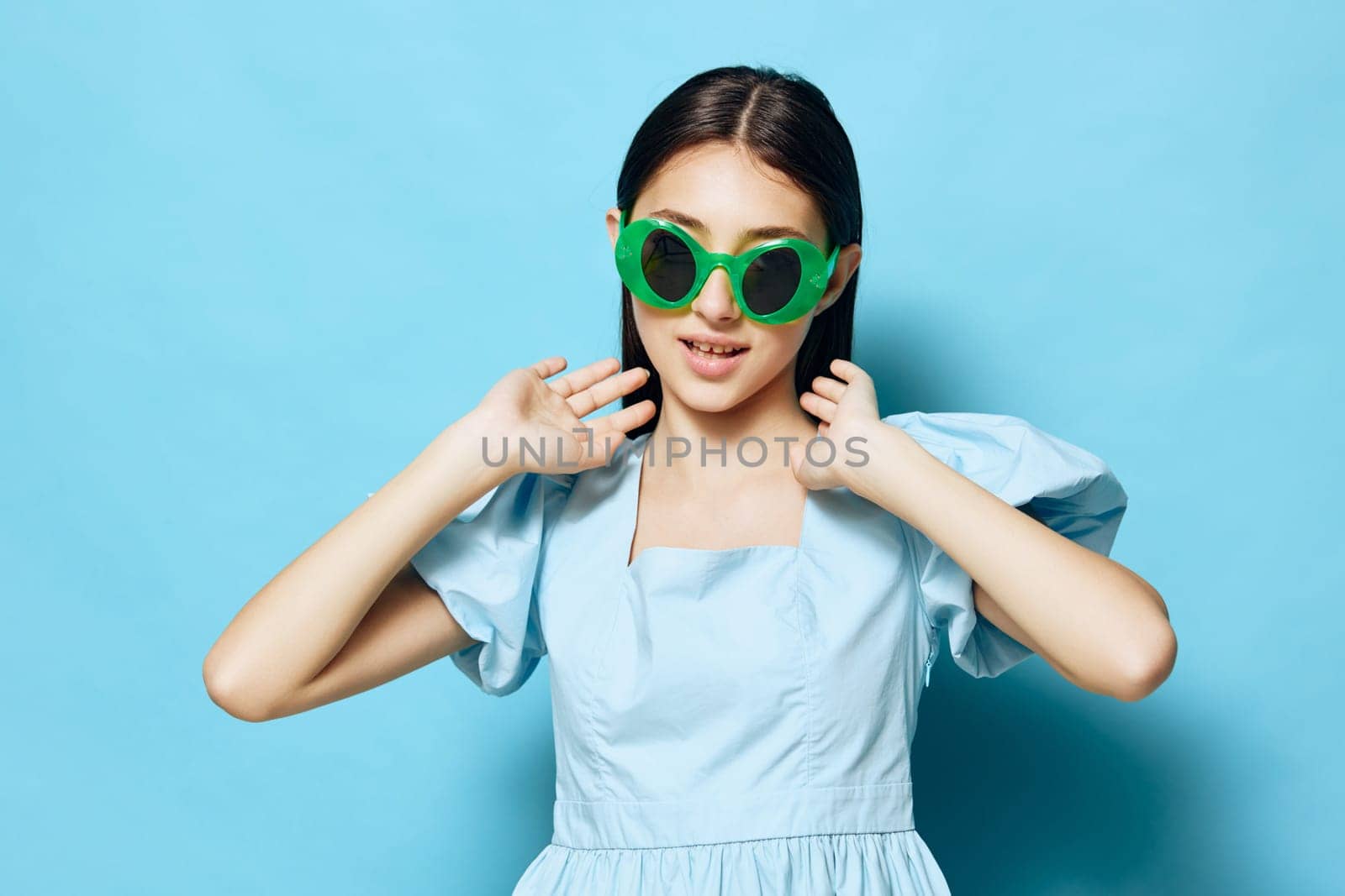 lifestyle woman beautiful studio dance fashionable isolated lady summer beauty vogue model blue dress attractive female hair young style background fashion