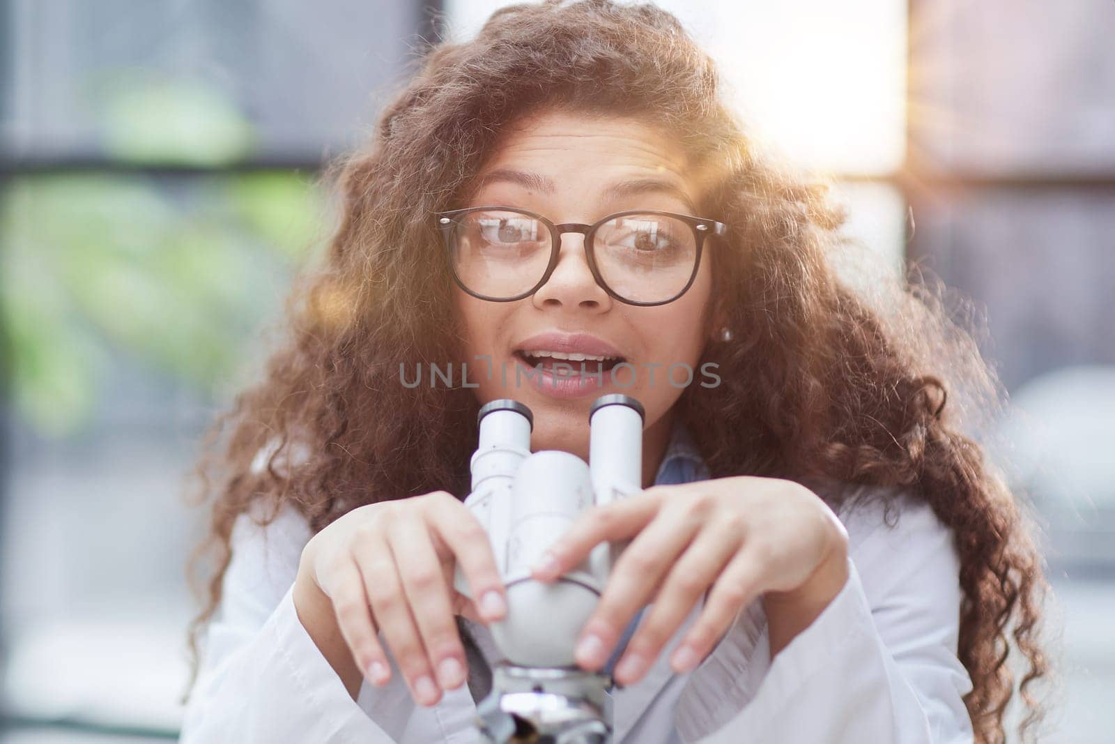 Female scientist researcher conducting an experiment in a labora
