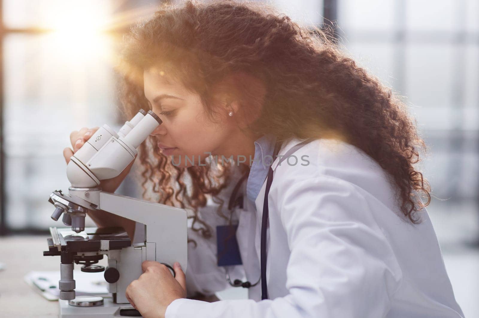 Female scientist researcher conducting an experiment in a labora