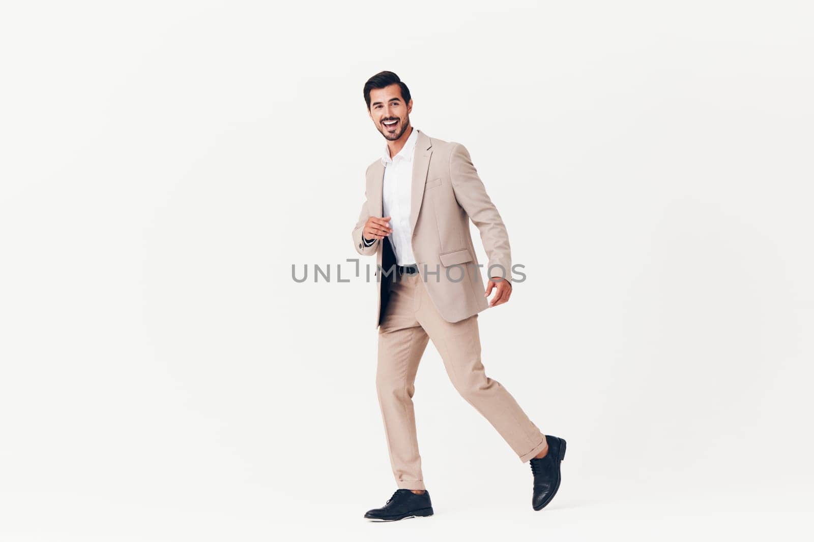 man confident male winner suit job beige business smiling copyspace idea happy businessman arm running young sexy victory tie background occupation
