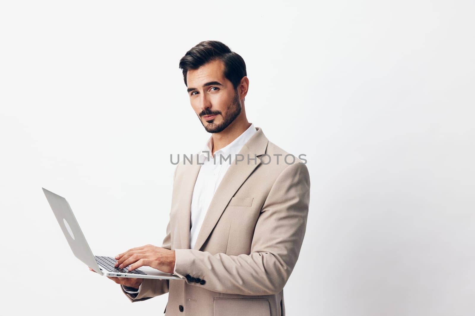business man young copyspace cyberspace professional computer freelancer internet beard person suit entrepreneur handsome white working job businessman smiling laptop corporate