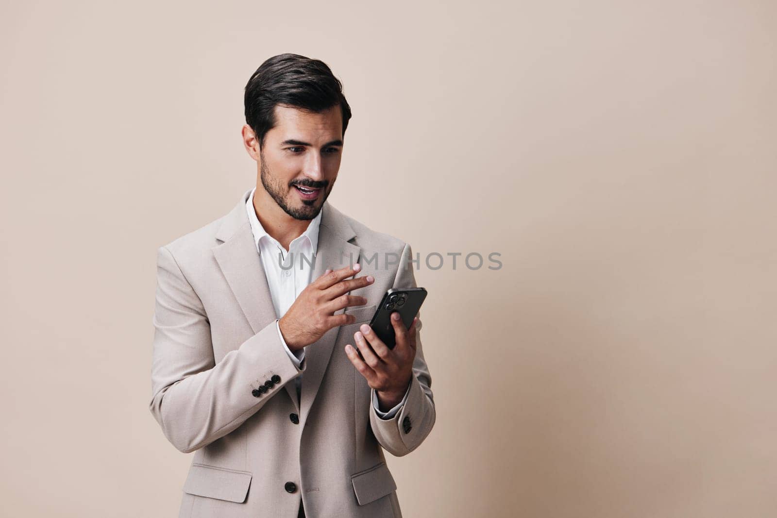 man smile business hold smartphone young suit phone portrait happy call by SHOTPRIME