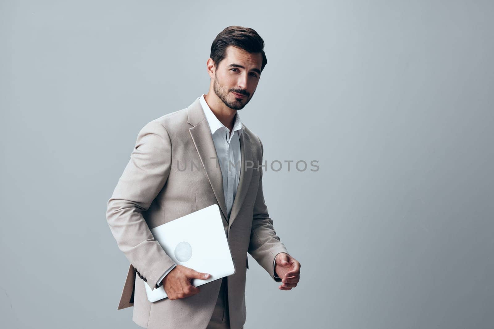 man job businessman copyspace suit computer handsome office portrait stylish freelancer young business studio model smiling network white internet laptop background