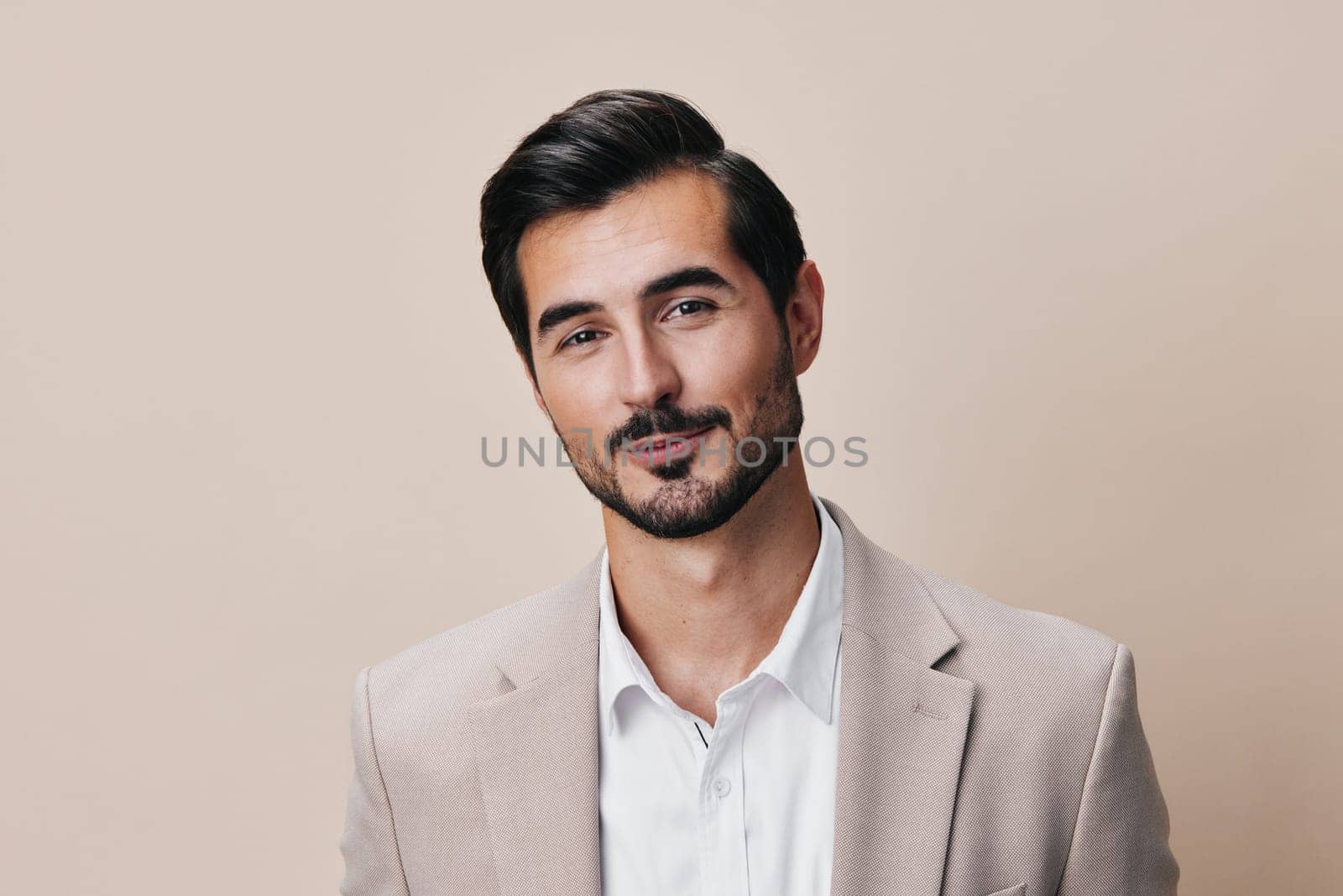 person man successful beige posing happy businessman business confident fashion smiling entrepreneur young male isolated handsome crossed copyspace model portrait suit