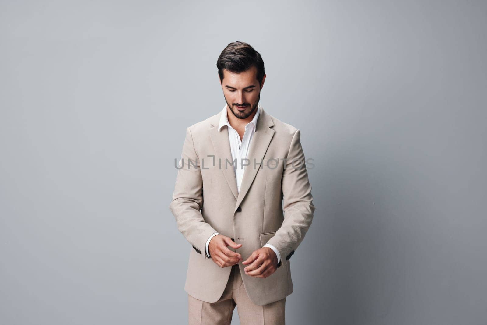 folded man guy job copyspace smiling smile happy suit portrait isolated handsome crossed formal attractive beige background businessman person business model