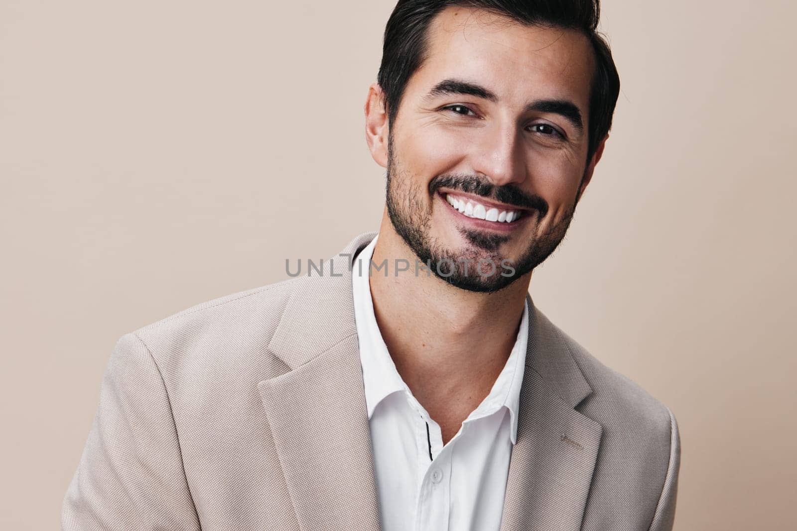 man business businessman handsome smiling copyspace portrait suit grey beige happy by SHOTPRIME