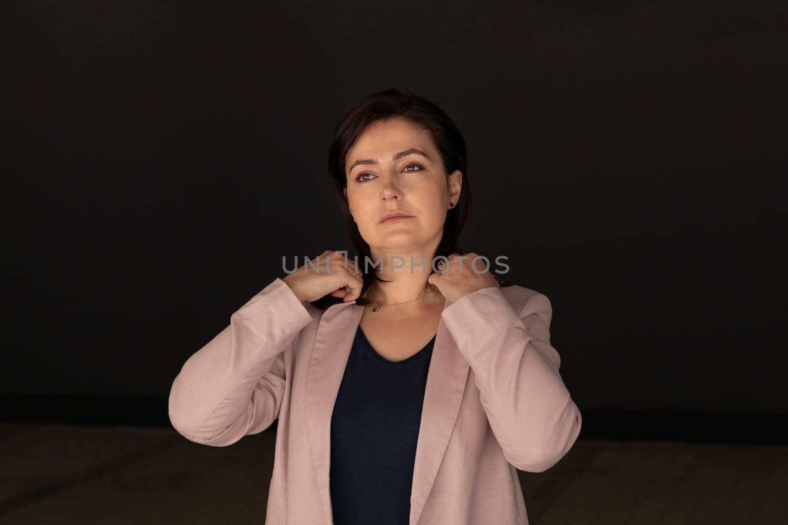 Portrait Confident Mature 40 yo Beautiful Woman. Caucasian Burnette Female With Brown Eyes Looks At Camera, Wears Pink Jackets, Blue Shirt. Horizontal Plane. Business Concept. High quality photo