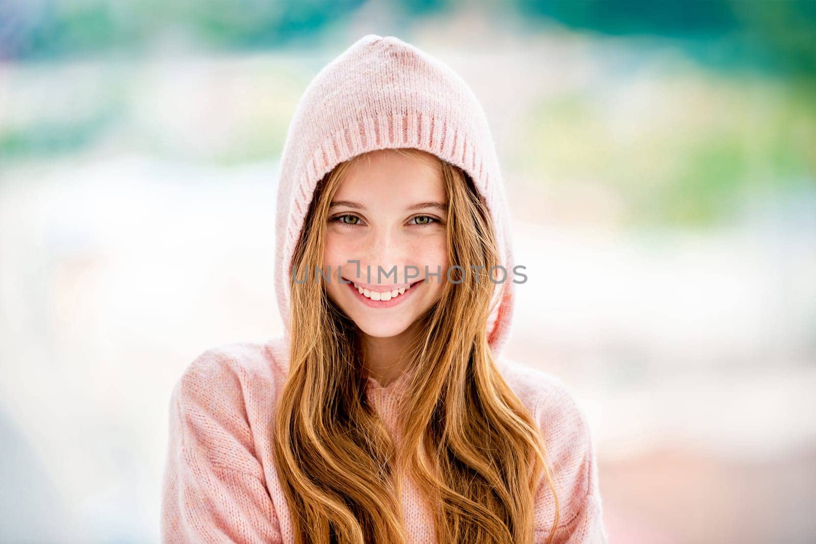 Beautiful teenage girl wearing hood