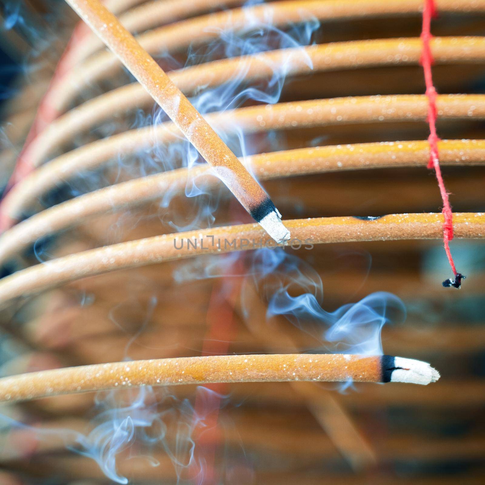 Burned coil swirl incense in Macau (Macao) temple,traditional Chinese cultural customs to worship god,close up,lifestyle.