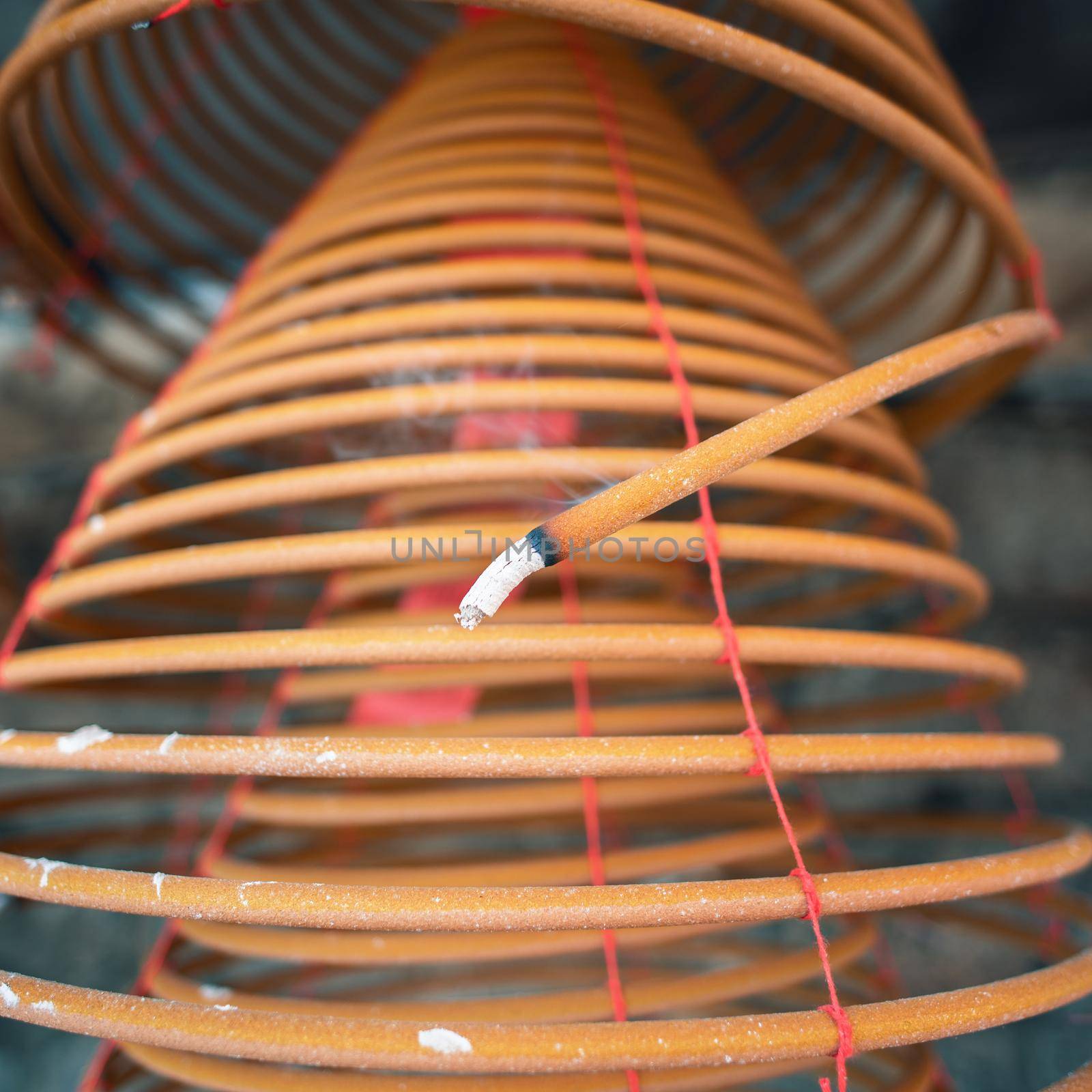 Burned coil swirl incense in Macau (Macao) temple,traditional Chinese cultural customs to worship god,close up,lifestyle. by ROMIXIMAGE