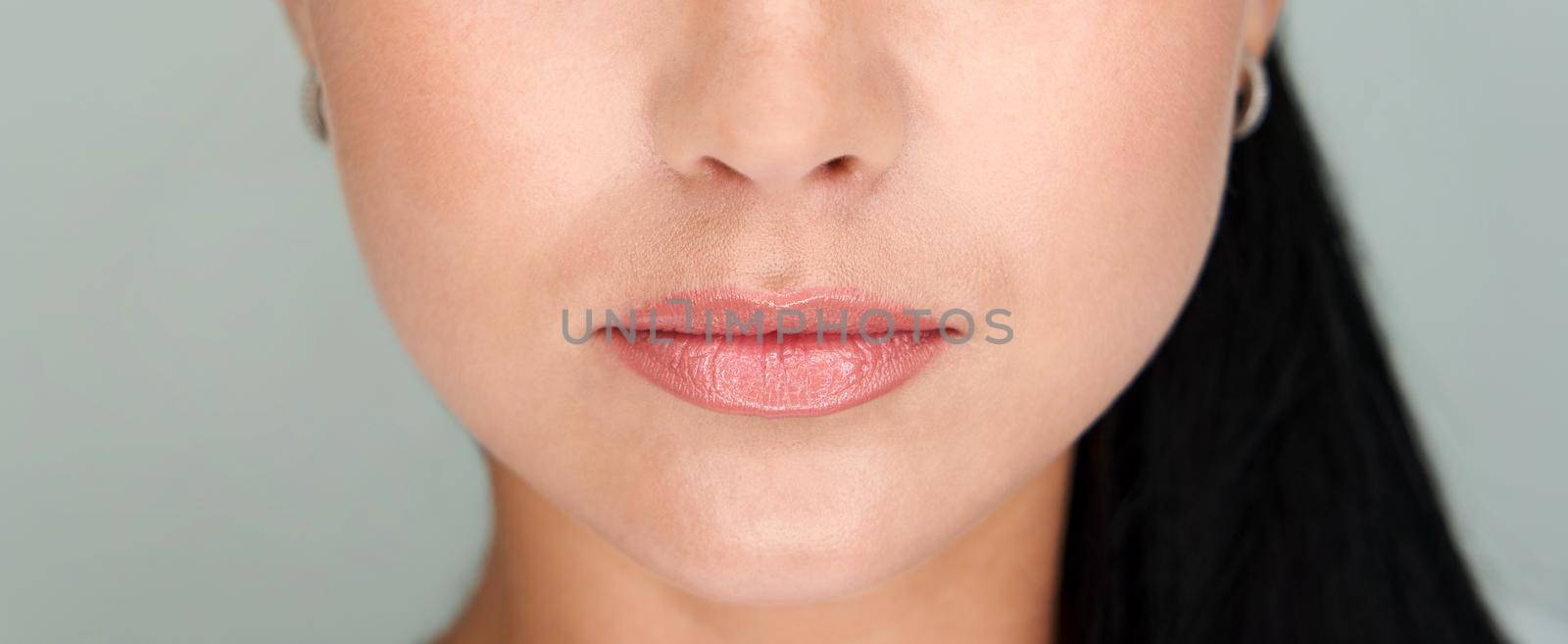 Beautiful lips Close-up. Makeup. Lip matte lipstick. Sexy lips. Part of face, young woman close up by Mariakray