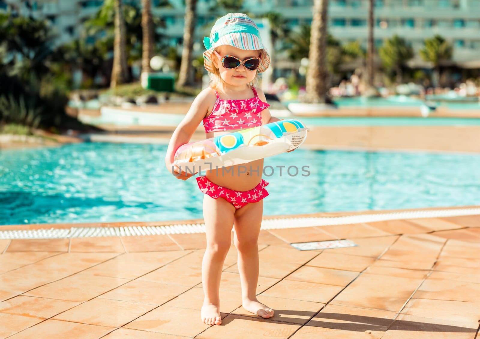 little cute girl near the pool by tan4ikk1