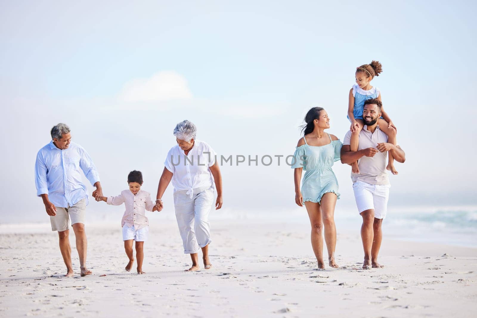 Big family, grandparents walking or kids on beach with young siblings holding hands on holiday together. Dad, mom or children love bonding, smiling or relaxing with senior grandmother or grandfather by YuriArcurs