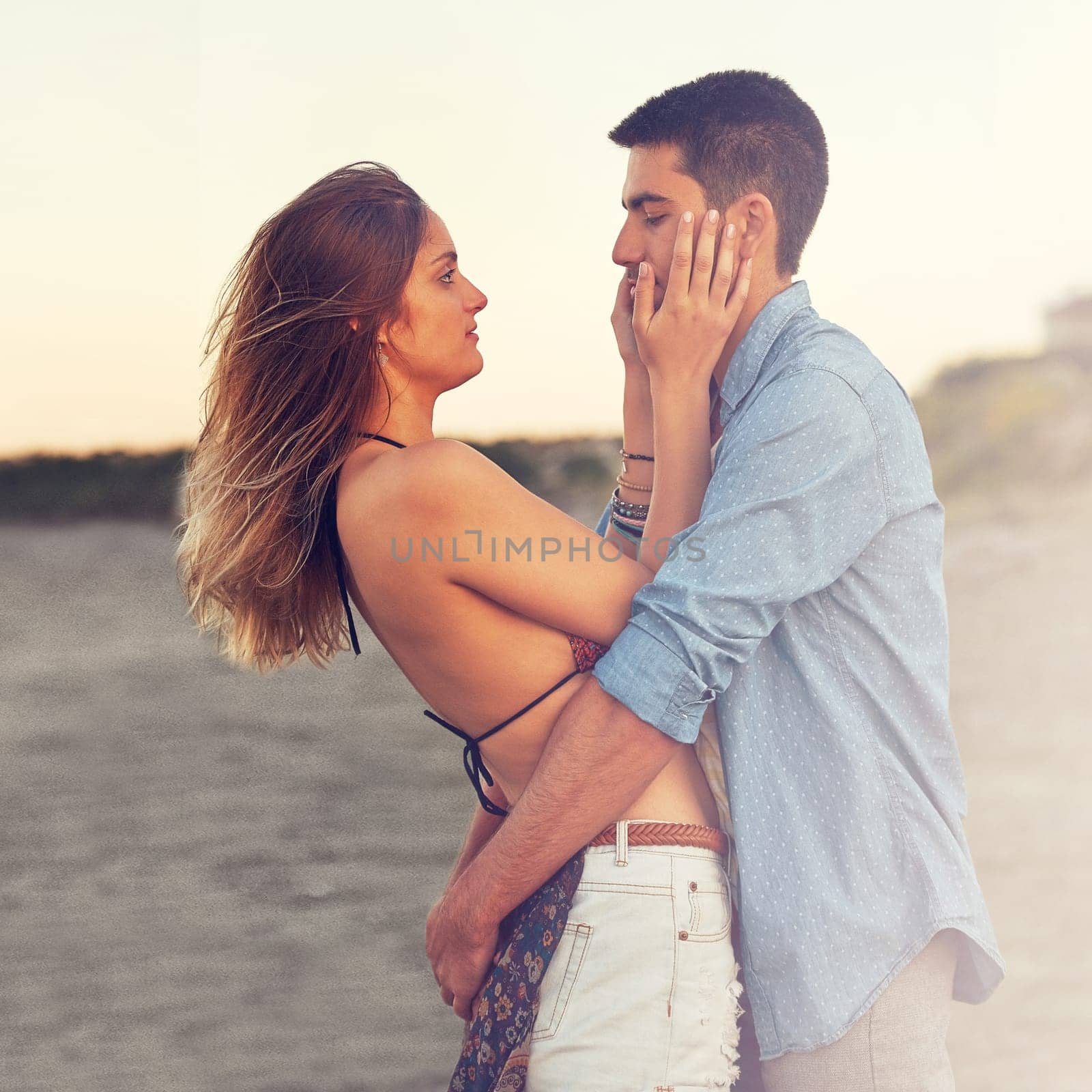 Love is all in the eyes. an affectionate young couple at the beach