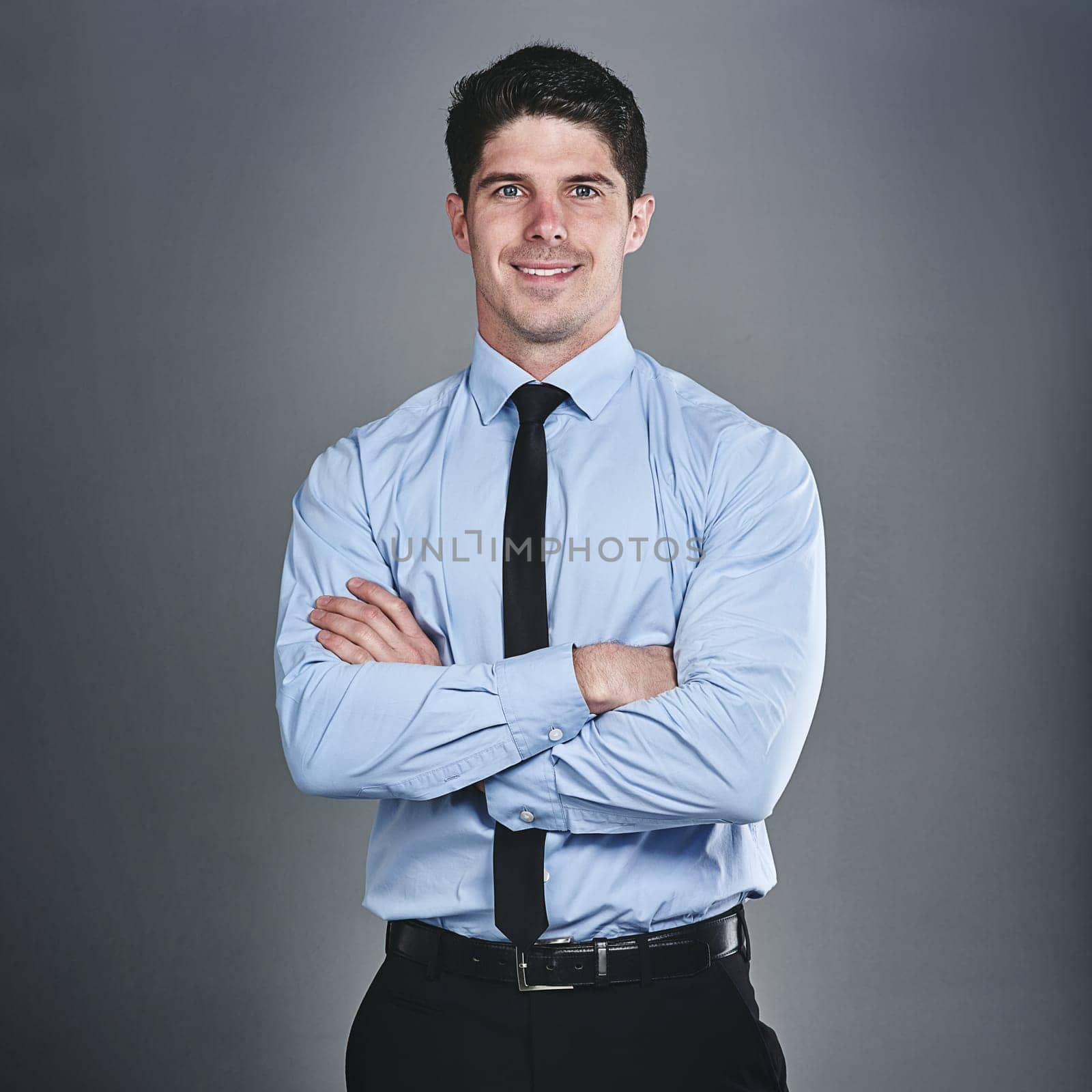 Its time to level up on my success. Studio portrait of a young businessman posing against a grey background