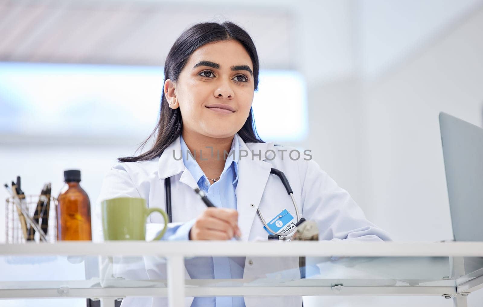 Healthcare, woman and doctor writing, thinking or planning with ideas, innovation or schedule. Female person, employee or medical professional with thoughts, deadline or laptop with wellness or notes by YuriArcurs