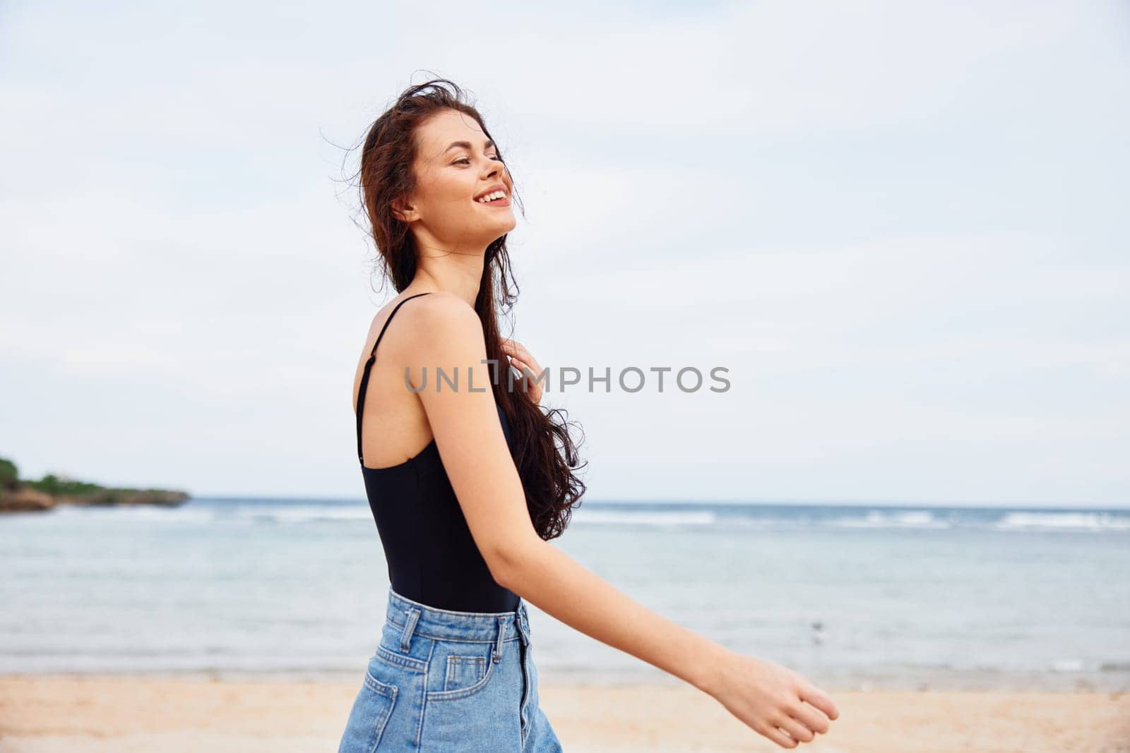 sand woman ocean nature running beach young freedom travel tropical smile adult vacation coast sea happiness summer enjoyment copy sunset leisure space