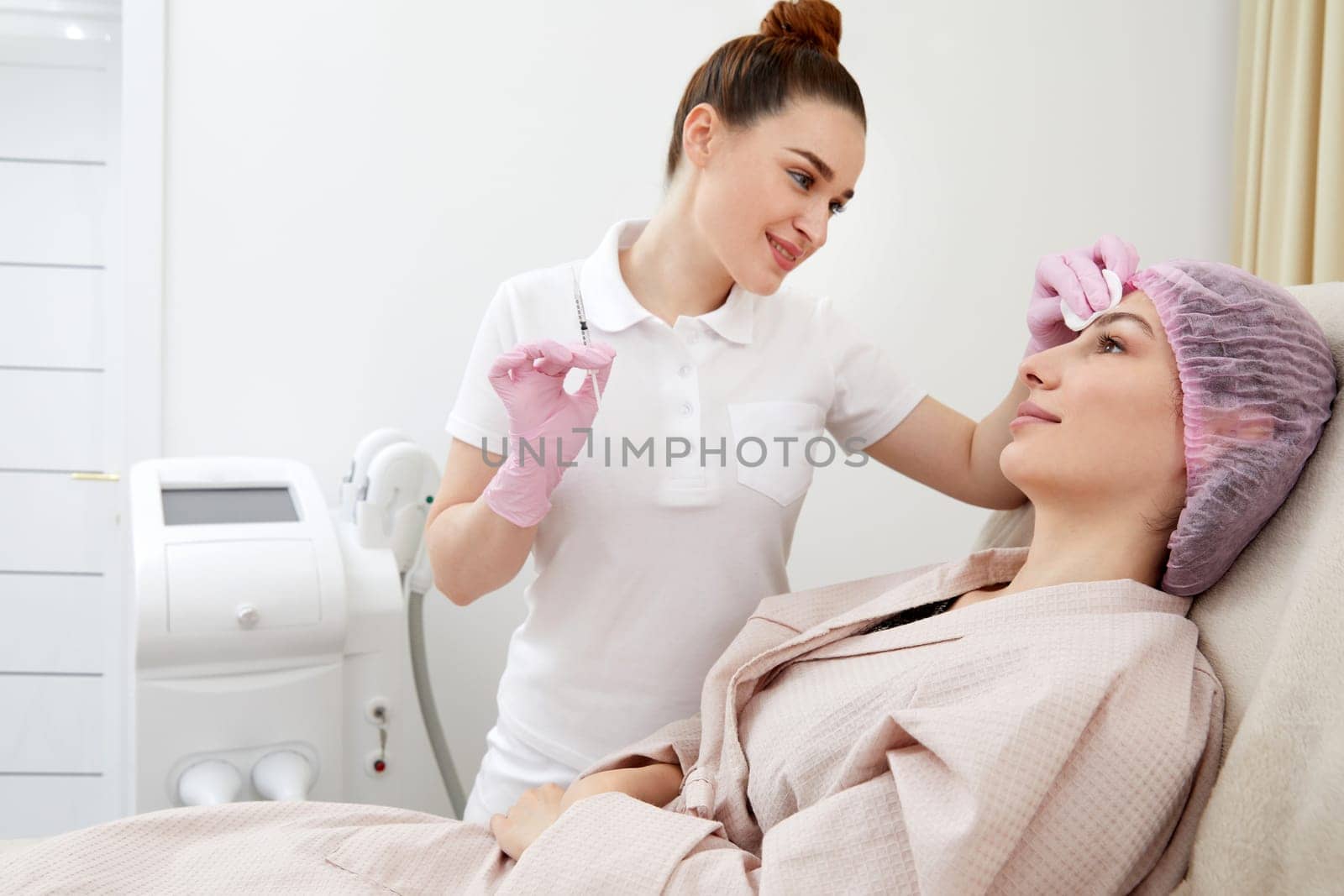 Cosmetologist performs the lift procedure by injecting beauty injections. Doctor injecting hyaluronic acid as a facial rejuvenation treatment