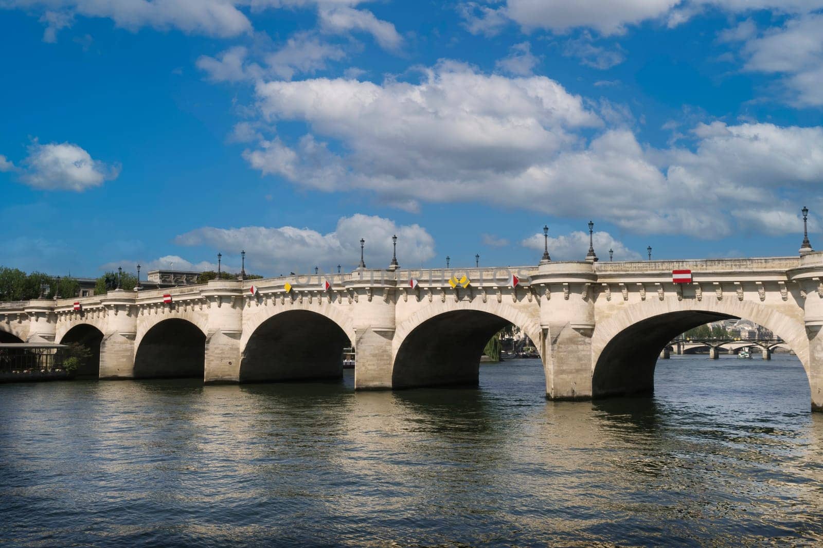 View of the Pont Neuf over the Seine river in Paris. It is the oldest bridge in the city.