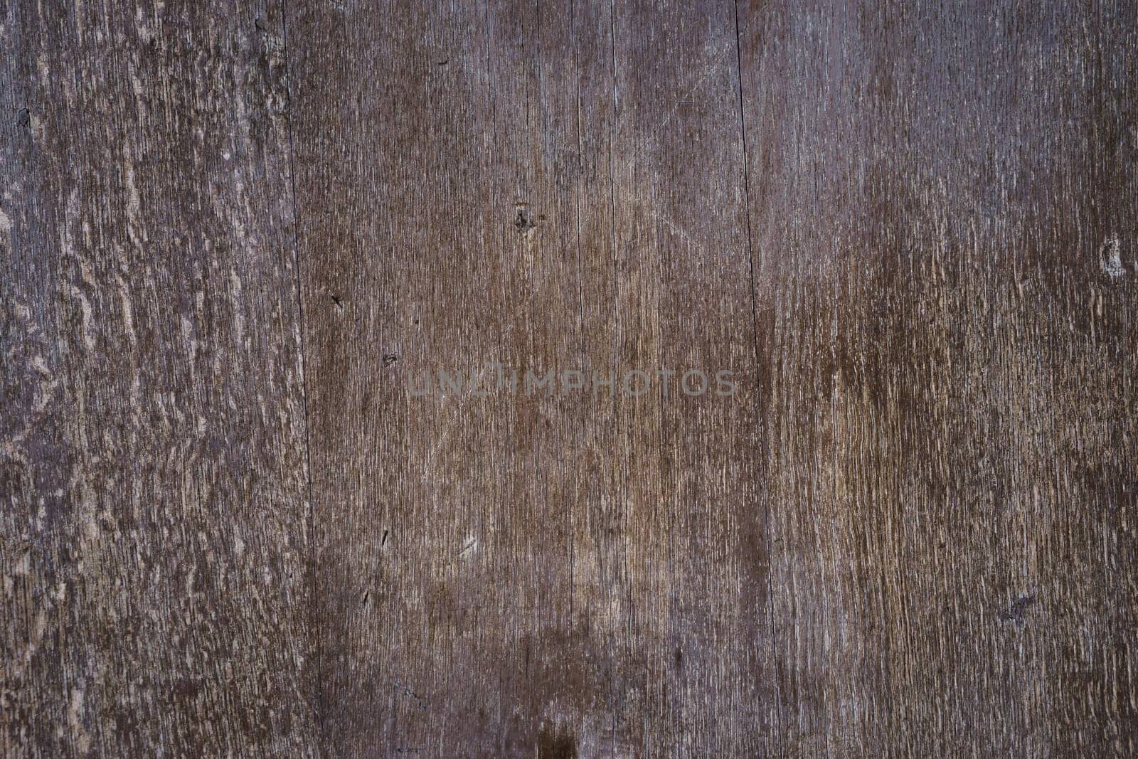 Texture of an old wooden door in brown tones. Concept backgrounds and stencils.