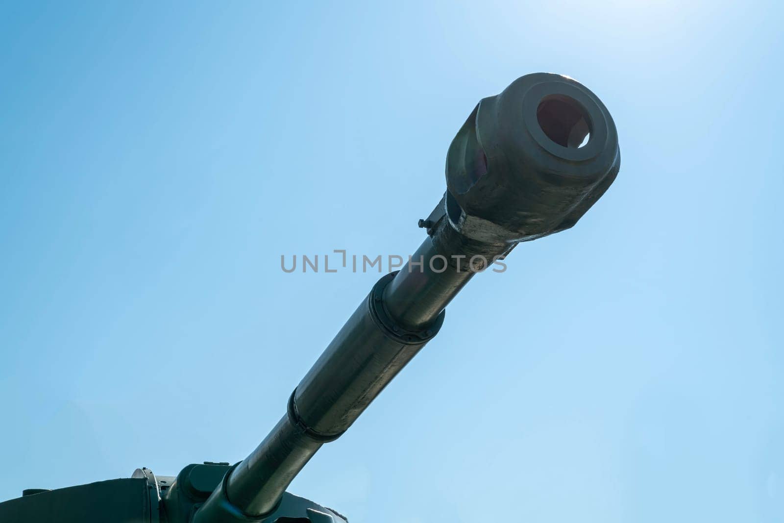 the barrel of the tank against the blue sky. photo