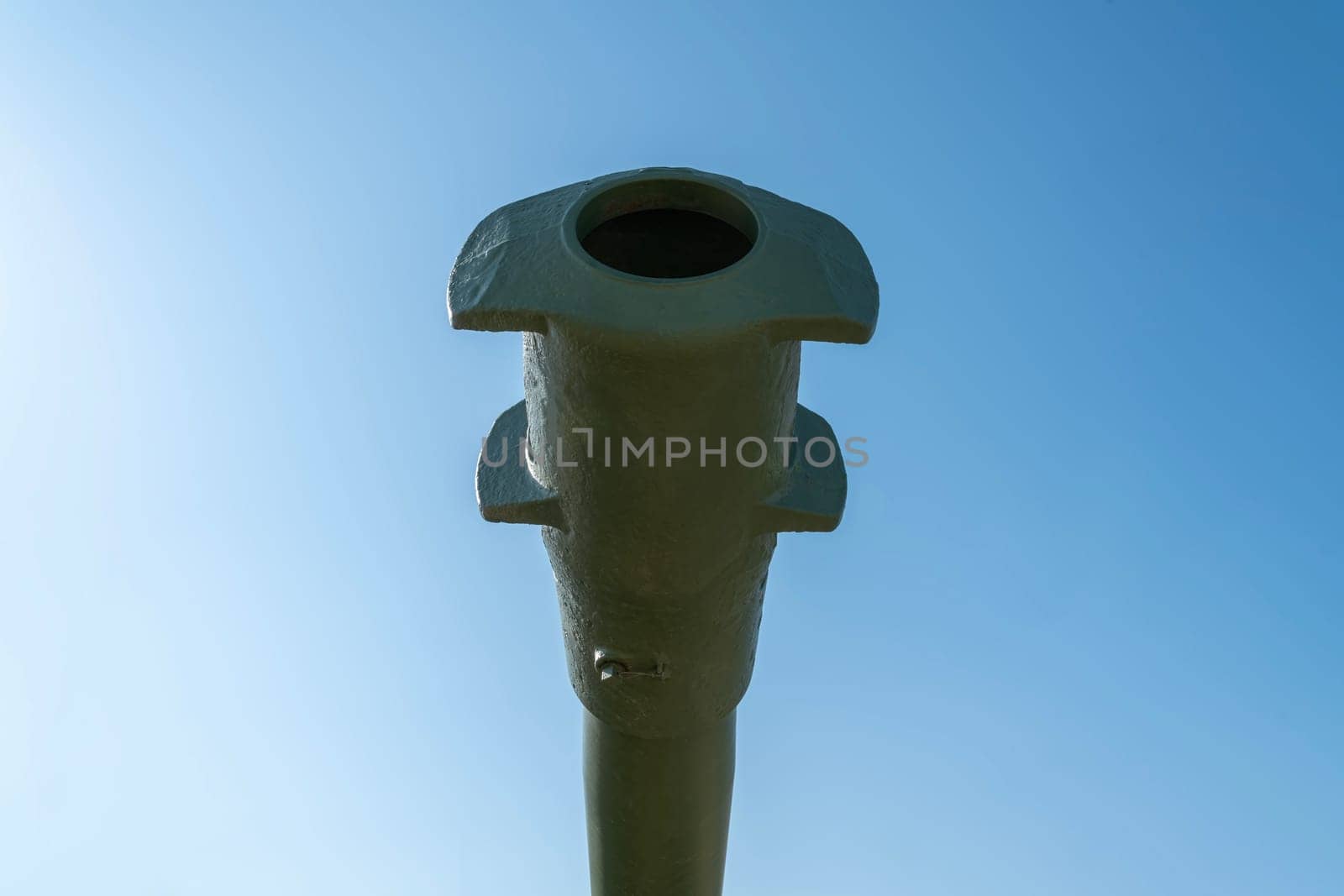 the barrel of the tank against the blue sky. photo