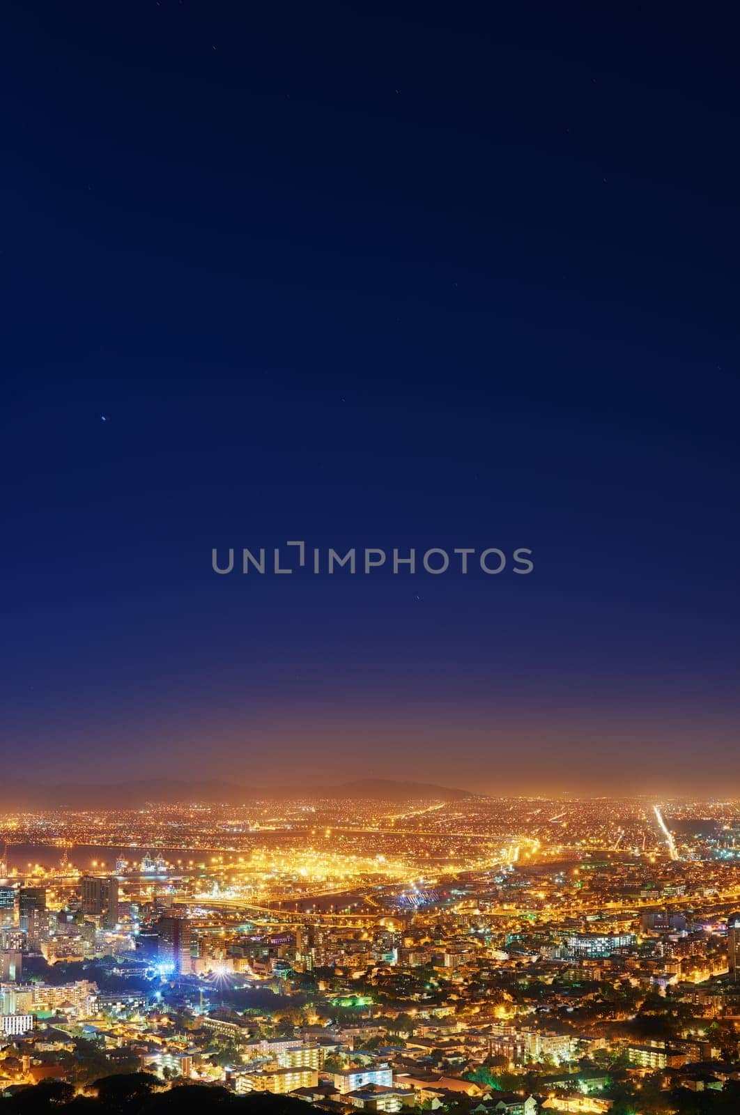 Night, sky and city with lights, buildings and Cape Town with view, traffic and urban development. Future, cloud and industry with growth, transportation and landscape with streets, dark and travel by YuriArcurs