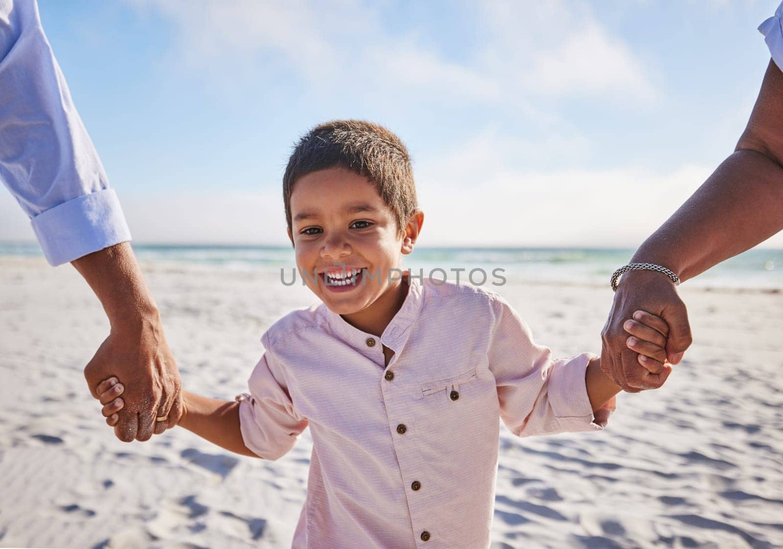Holding hands, beach or portrait of a happy kid walking on a holiday vacation together with happiness. Parents, mother and father playing or enjoying family time with a young boy or child in summer by YuriArcurs