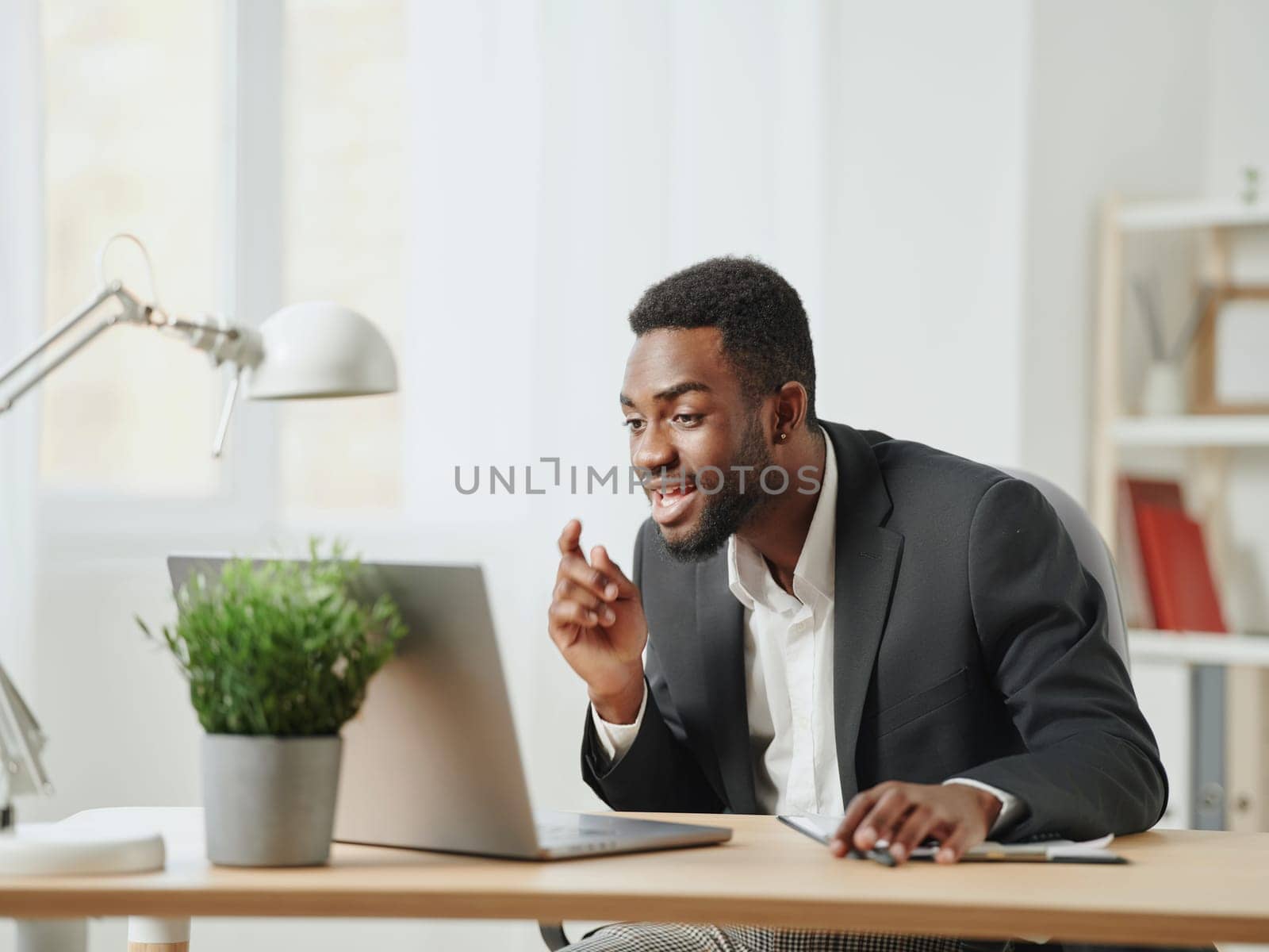man education computer online looking student african american office freelancer laptop job by SHOTPRIME