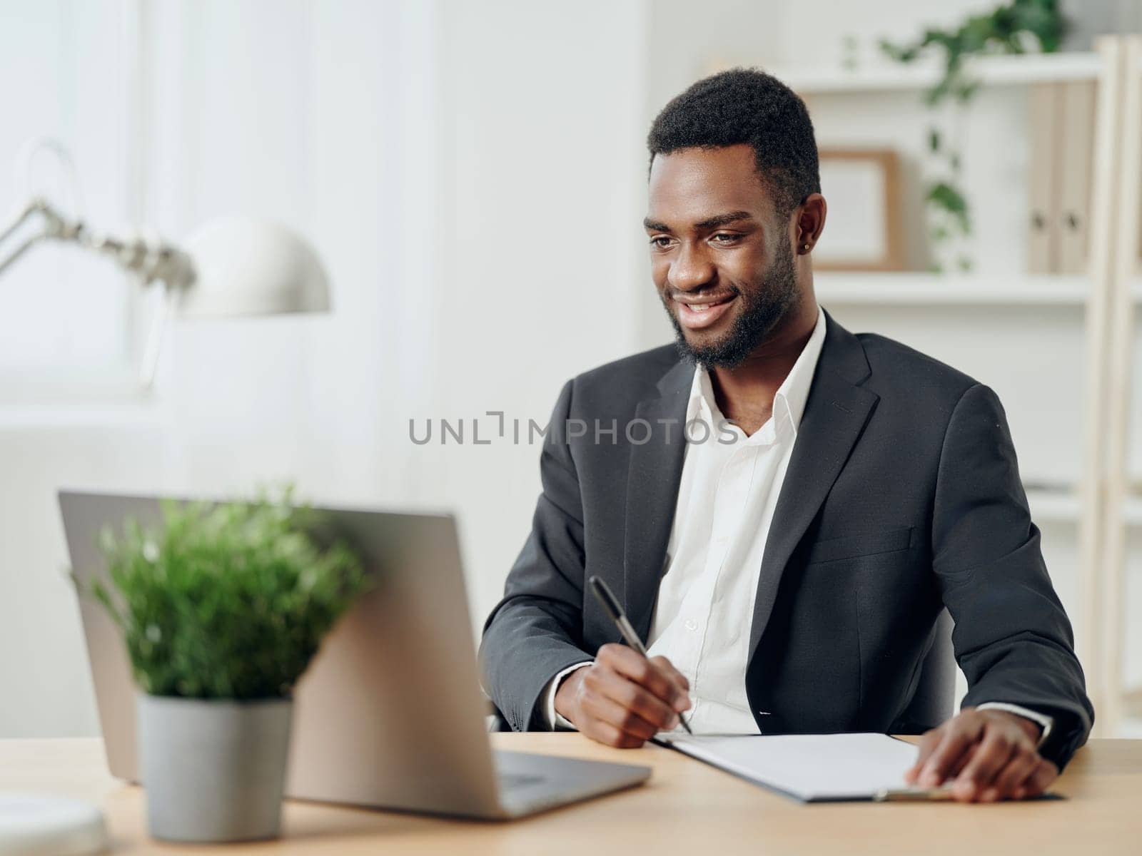 man computer laptop job online african freelancer student education web office american by SHOTPRIME