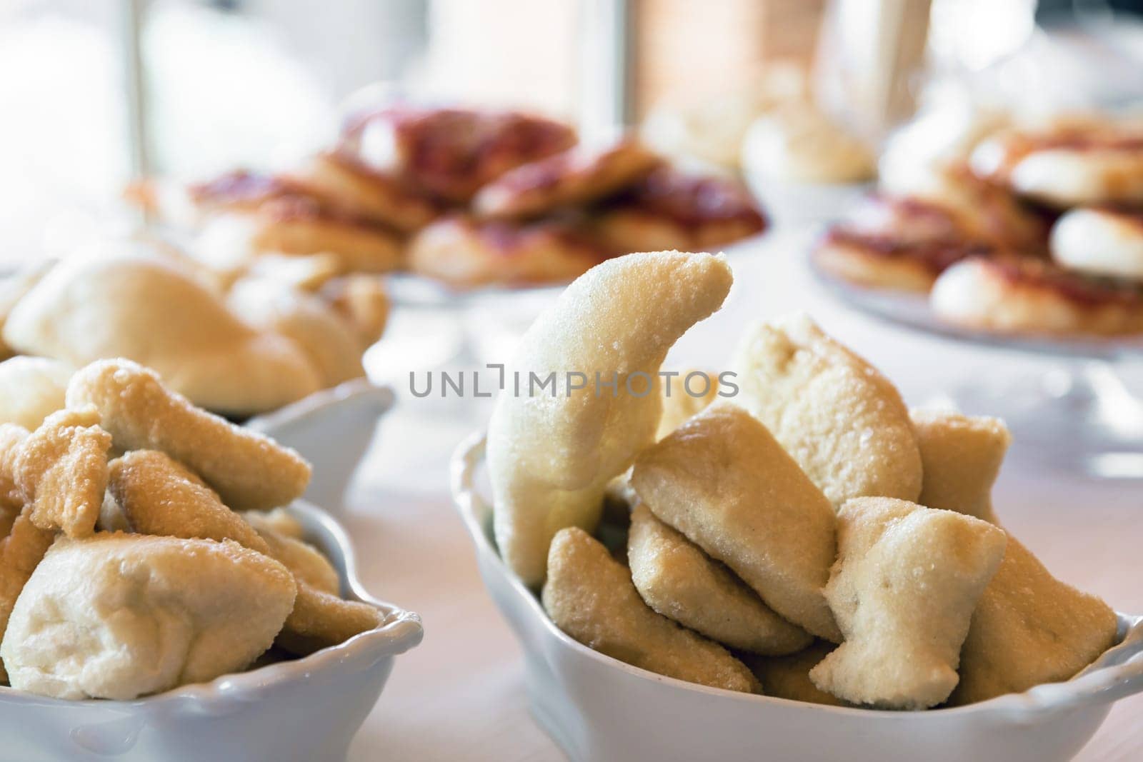 Battered appetizers. Delicious and crunchies appetizer in ceramic white dishes.