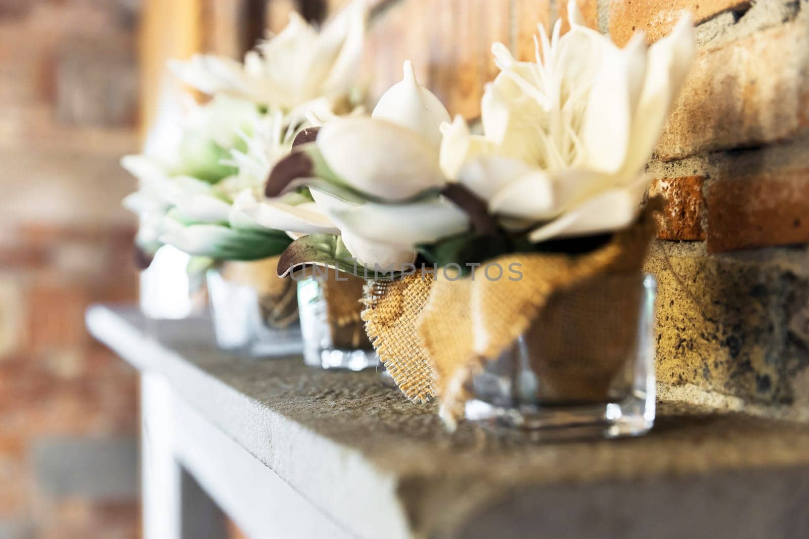 Floral decoration in glass jars. Concepts and events. Selective focus.