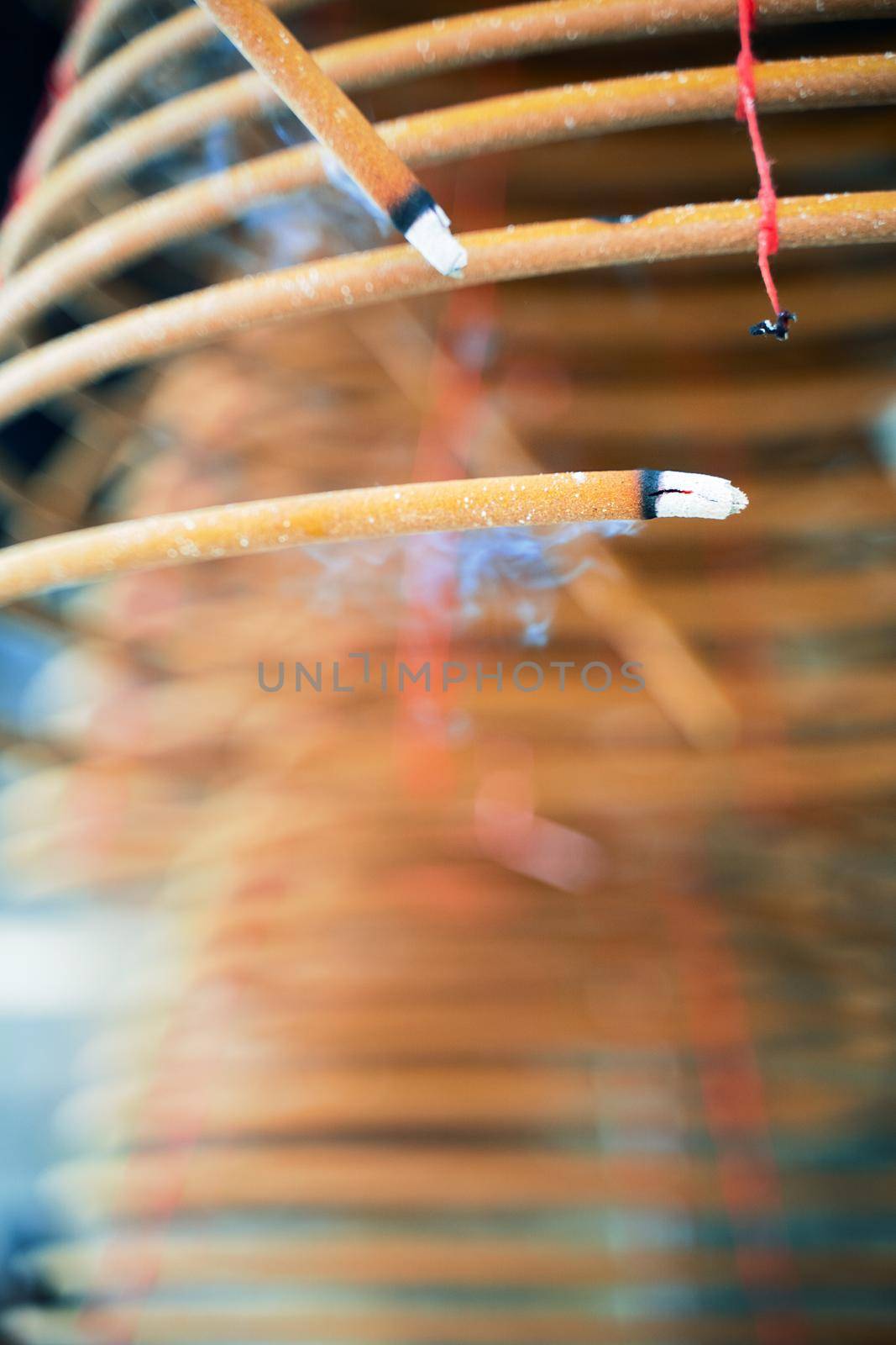 Burned coil swirl incense in Macau (Macao) temple, traditional Chinese cultural customs to worship god, close up, lifestyle.