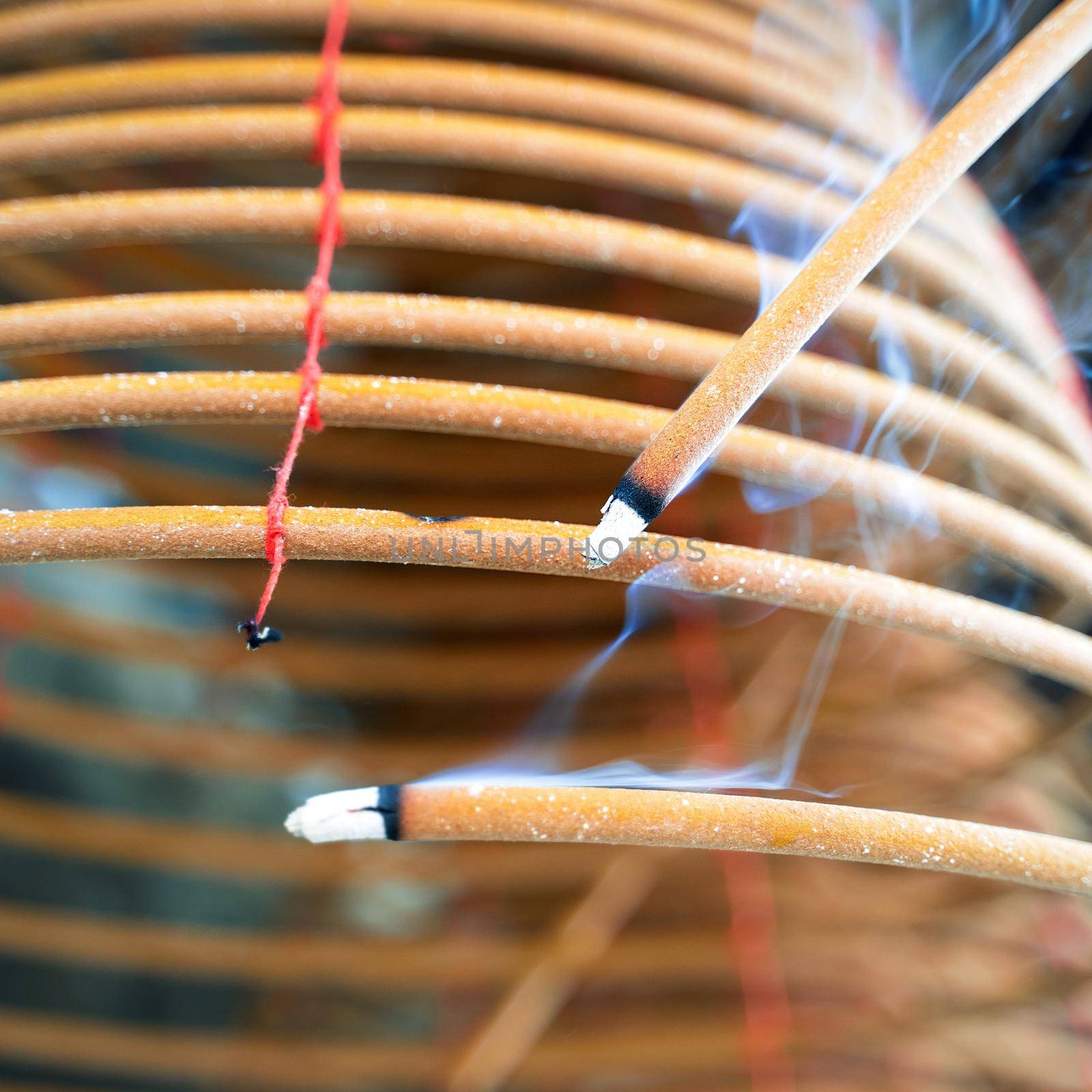 Burned coil swirl incense in Macau (Macao) temple,traditional Chinese cultural customs to worship god,close up,lifestyle. by ROMIXIMAGE