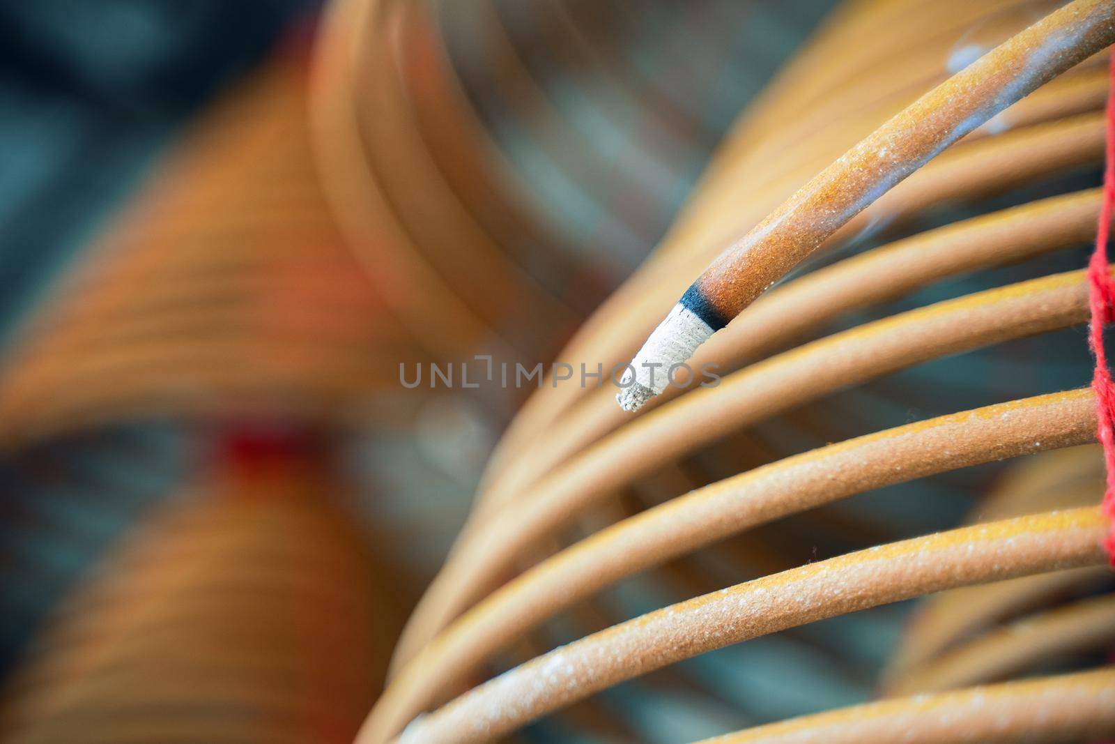 Burned coil swirl incense in Macau (Macao) temple, traditional Chinese cultural customs to worship god, close up, lifestyle.