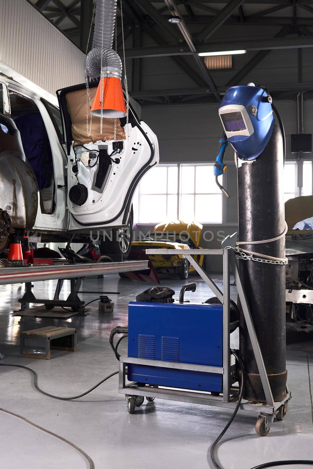Welding equipment in a car repair station, no people
